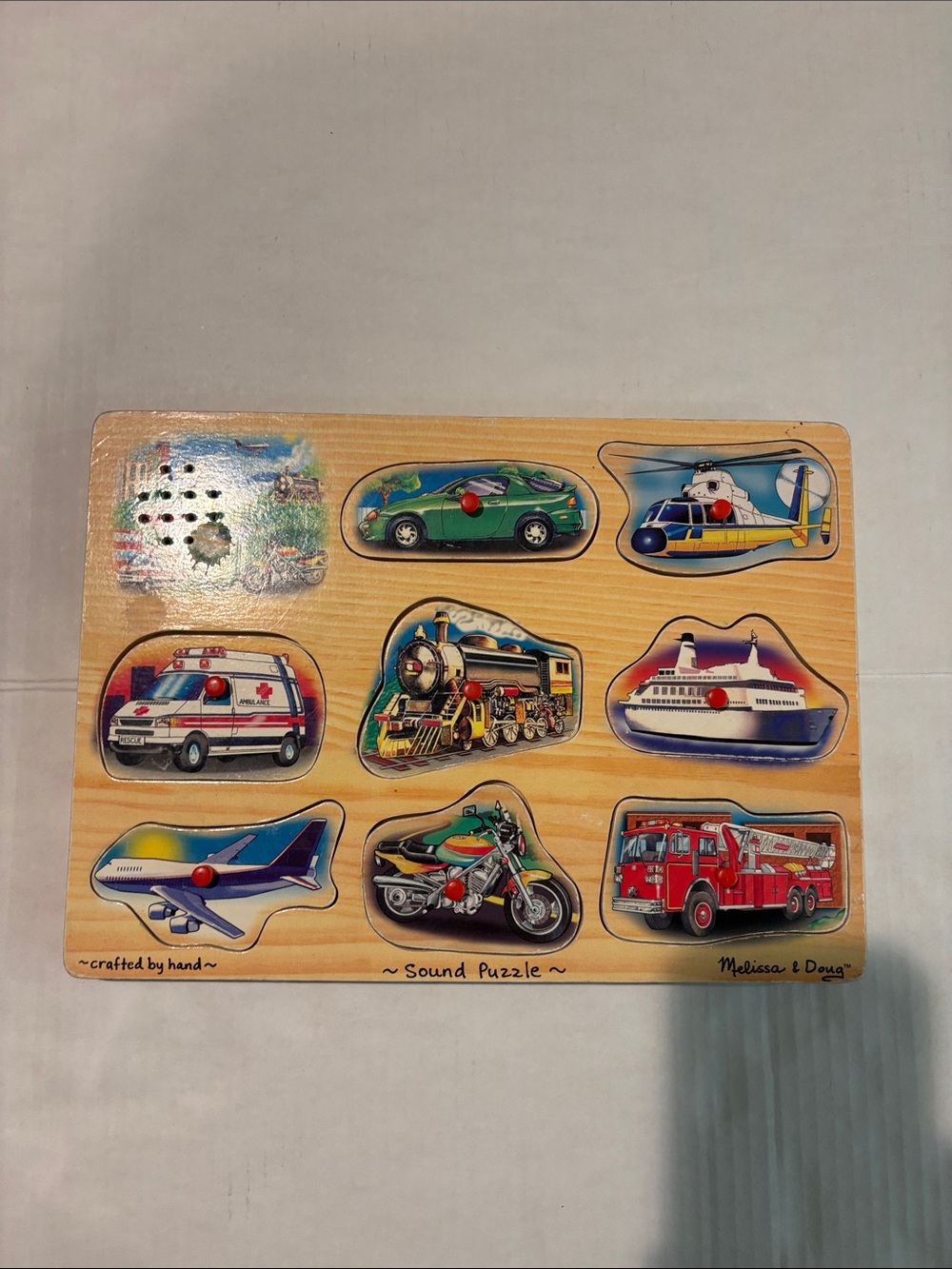 Melissa & Doug Wooden Vehicles Sound Puzzle – Red, Green, Blue, Yellow, Black
